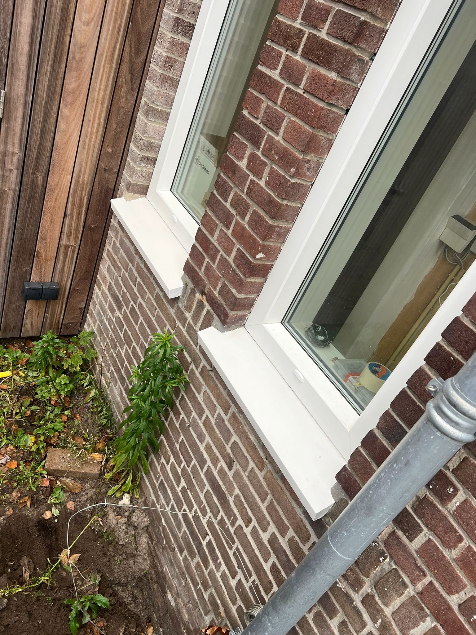 Schilderwerk aan houten kozijnen